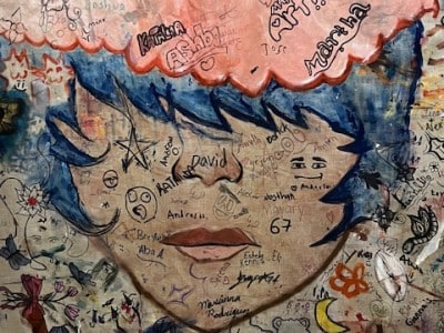 Mural welcomes visitors upstairs in the library. Photo by Steve Milmore.