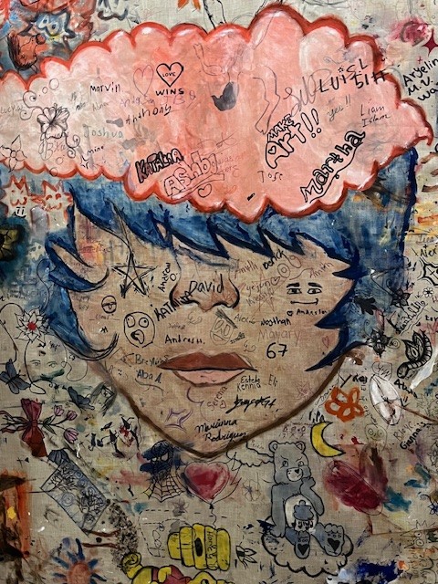 Mural welcomes visitors upstairs in the library. Photo by Steve Milmore.