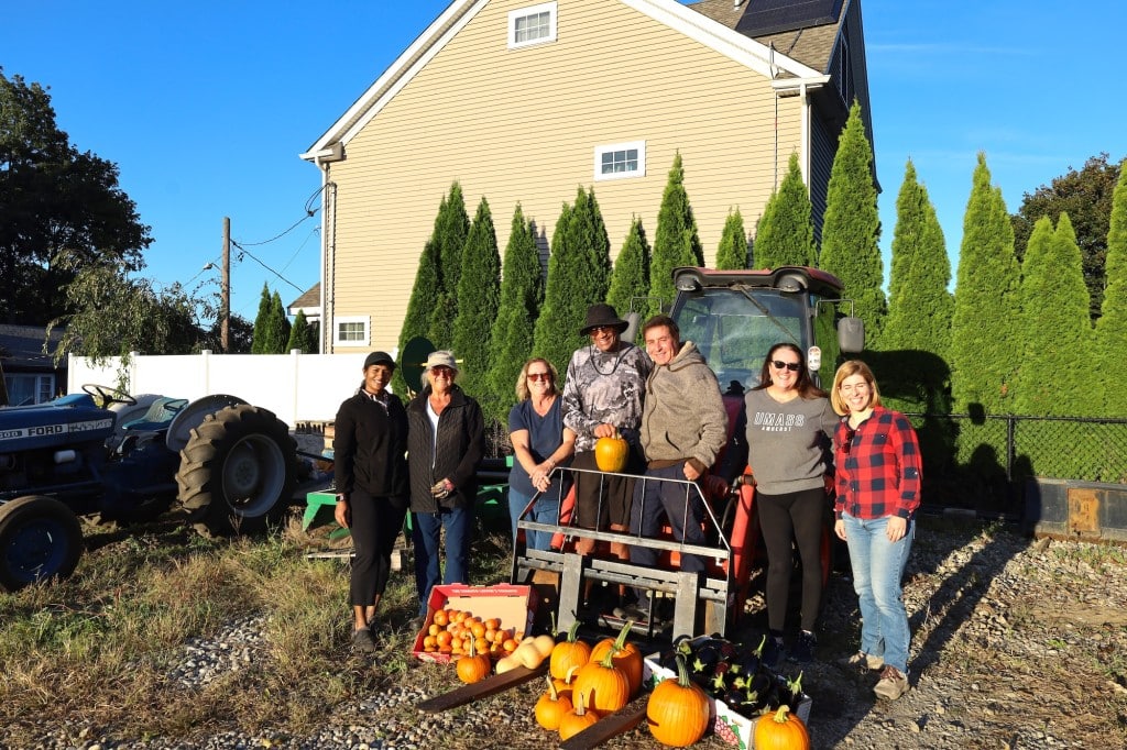 A community harvest blossoms from a backyard farm rooted in giving back ...